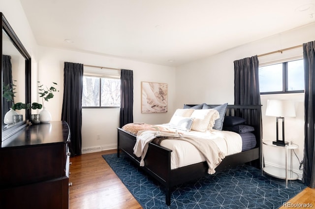 3004 S Niagara Way, Denver, CO 80224 - bedroom with wood finished floors and baseboards