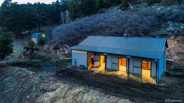 exterior space featuring an outbuilding