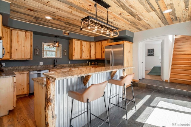 kitchen with an inviting chandelier, light brown cabinets, wood ceiling, a sink, and appliances with stainless steel finishes