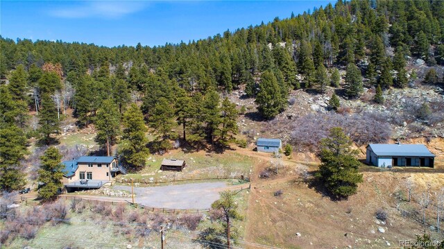 aerial view featuring a view of trees