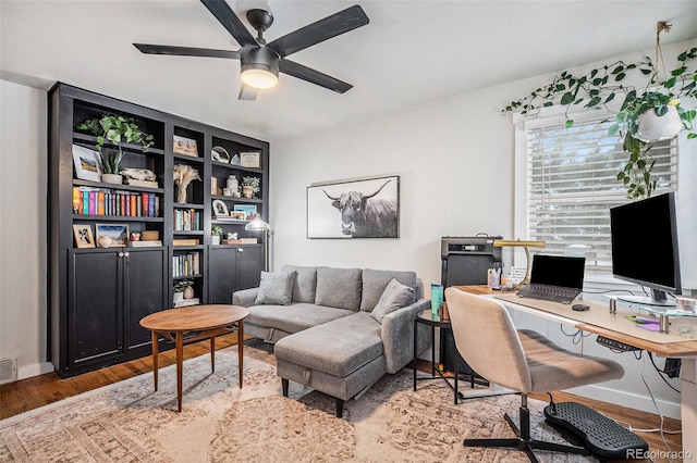 office space with ceiling fan and wood-type flooring