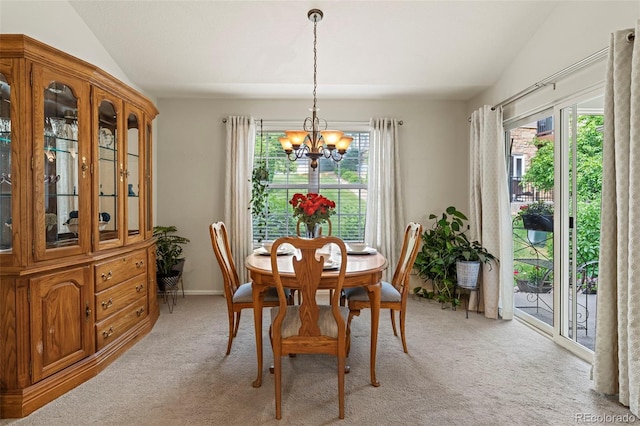 8009 S Algonquian Ct, Aurora, CO 80016 - dining space with a chandelier, plenty of natural light, and light carpet