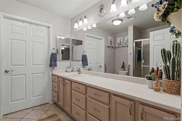 8009 S Algonquian Ct, Aurora, CO 80016 - bathroom with vanity, tile patterned floors, and a stall shower