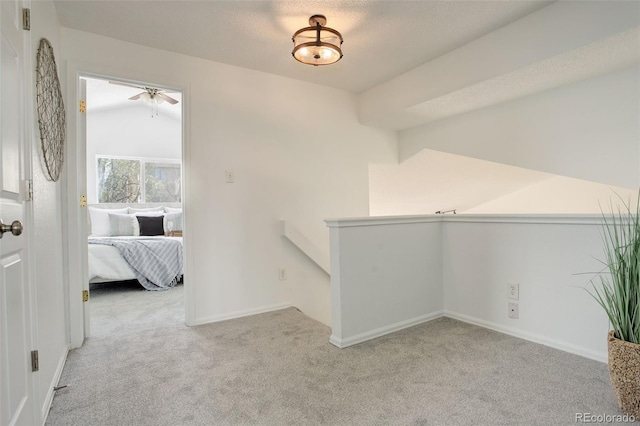 interior space featuring carpet floors and baseboards