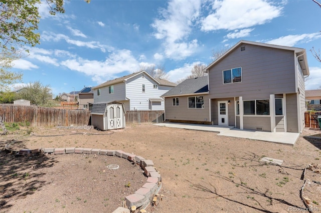 back of property featuring a patio area, a fenced backyard, an outdoor structure, and a storage shed