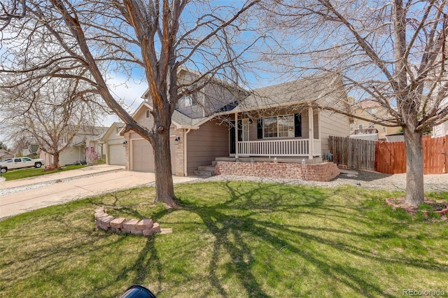 view of front of property with driveway, a porch, fence, a garage, and a front yard
