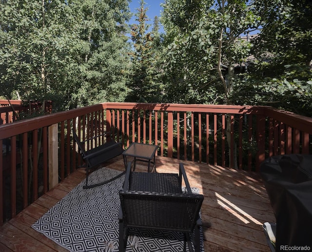 77 Spyglass Ln Unit 77, Silverthorne, CO 80498 - wooden deck with a grill