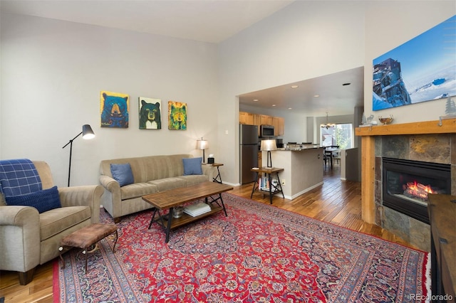 77 Spyglass Ln Unit 77, Silverthorne, CO 80498 - living room with light wood-style flooring and a fireplace