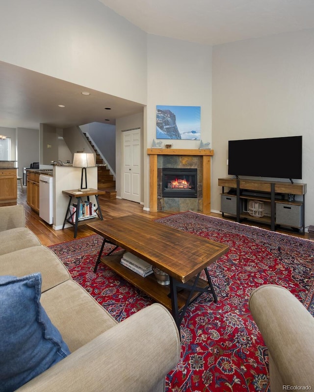 77 Spyglass Ln Unit 77, Silverthorne, CO 80498 - living area featuring wood finished floors, stairway, a fireplace, and recessed lighting