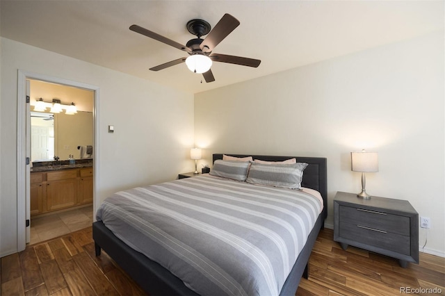 77 Spyglass Ln Unit 77, Silverthorne, CO 80498 - bedroom with wood finished floors, ensuite bath, and a ceiling fan