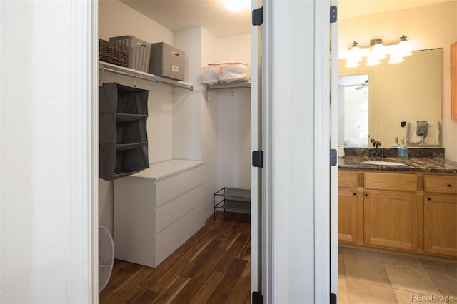 77 Spyglass Ln Unit 77, Silverthorne, CO 80498 - bathroom featuring vanity, wood finished floors, and ceiling fan