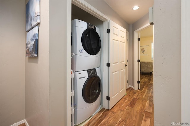 77 Spyglass Ln Unit 77, Silverthorne, CO 80498 - laundry area with stacked washer / dryer and light wood finished floors