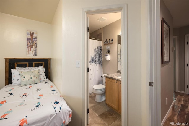 77 Spyglass Ln Unit 77, Silverthorne, CO 80498 - bedroom featuring ensuite bath and baseboards
