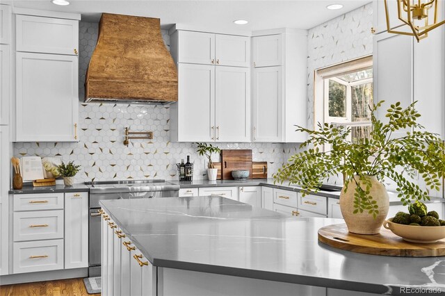10802 W Indore Dr, Littleton, CO 80127 - kitchen featuring custom range hood, stainless steel countertops, white cabinets, and recessed lighting