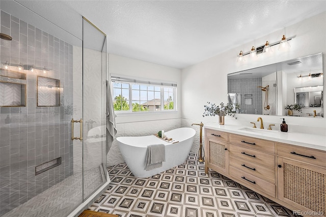 10802 W Indore Dr, Littleton, CO 80127 - full bathroom with a shower stall, vanity, and a freestanding bath