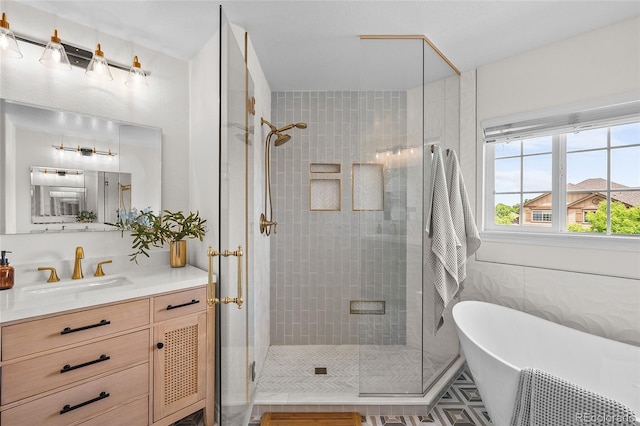10802 W Indore Dr, Littleton, CO 80127 - bathroom featuring a freestanding tub, a shower stall, and vanity