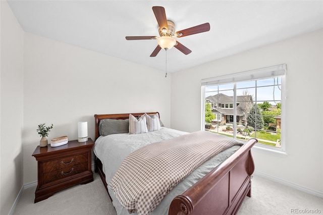 10802 W Indore Dr, Littleton, CO 80127 - bedroom with light colored carpet, baseboards, and ceiling fan