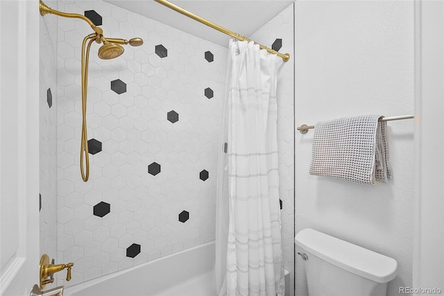 10802 W Indore Dr, Littleton, CO 80127 - bathroom featuring shower / bath combo with shower curtain and toilet