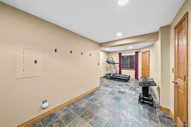 10802 W Indore Dr, Littleton, CO 80127 - workout area with electric panel, baseboards, stone finish flooring, and recessed lighting
