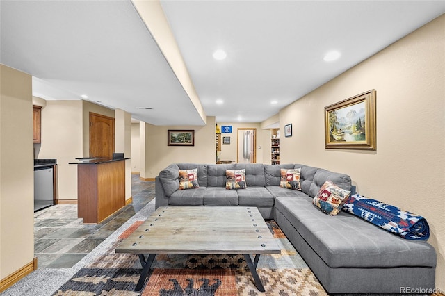10802 W Indore Dr, Littleton, CO 80127 - living area featuring stone finish flooring, recessed lighting, and baseboards