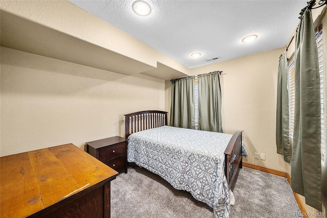 10802 W Indore Dr, Littleton, CO 80127 - carpeted bedroom featuring baseboards and a textured ceiling