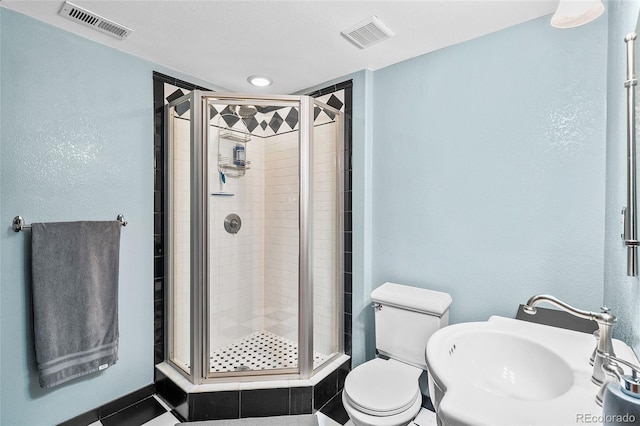 10802 W Indore Dr, Littleton, CO 80127 - full bath featuring a sink, a shower stall, and toilet