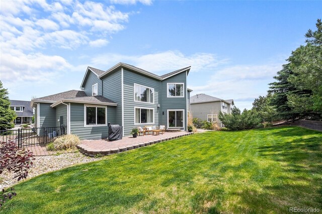 10802 W Indore Dr, Littleton, CO 80127 - rear view of house featuring a patio area