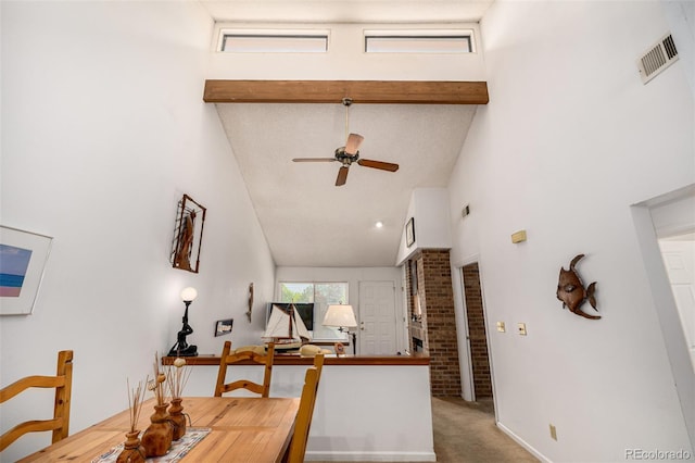 9400 E Iliff Ave Unit 88, Denver, CO 80231 - carpeted dining area featuring high vaulted ceiling, ceiling fan, and beamed ceiling