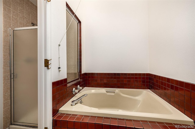 9400 E Iliff Ave Unit 88, Denver, CO 80231 - bathroom featuring a bath and a shower stall