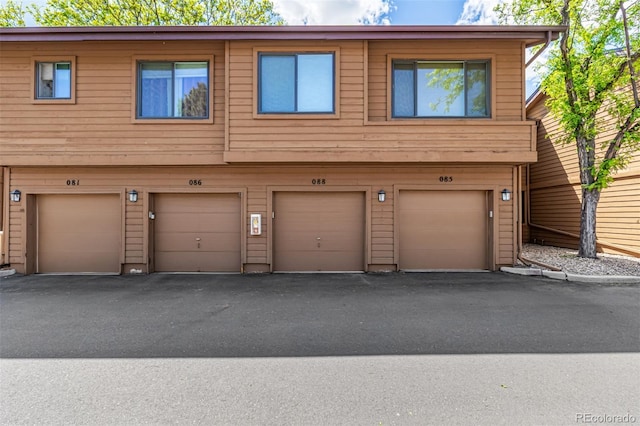 9400 E Iliff Ave Unit 88, Denver, CO 80231 - townhome / multi-family property featuring an attached garage