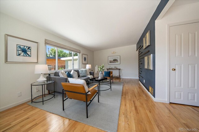 5975 Dover St, Arvada, CO 80004 - living area with light wood-style floors and baseboards