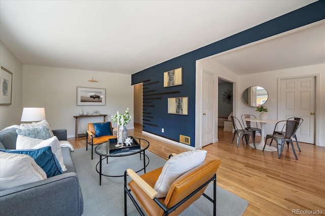 5975 Dover St, Arvada, CO 80004 - living area with light wood-style floors and baseboards