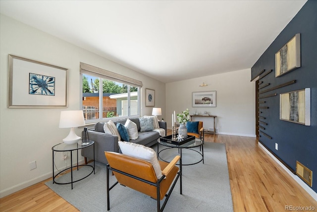 5975 Dover St, Arvada, CO 80004 - living room featuring wood finished floors and baseboards