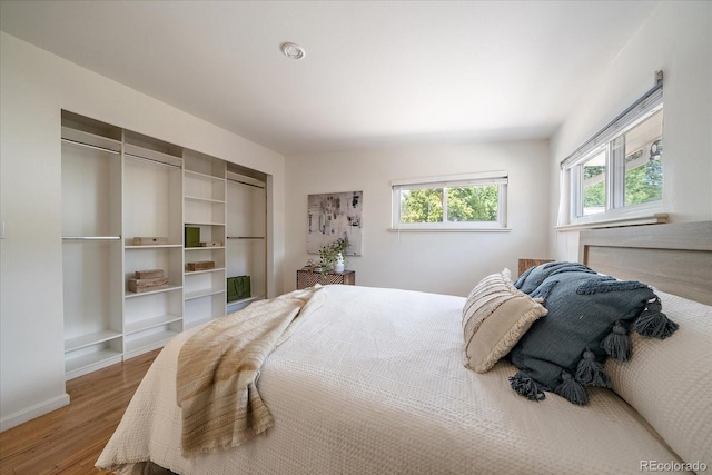 5975 Dover St, Arvada, CO 80004 - bedroom featuring wood finished floors and baseboards