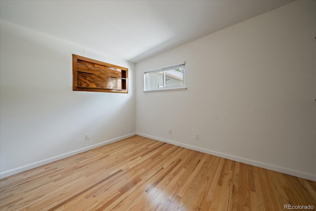 5975 Dover St, Arvada, CO 80004 - spare room with wood finished floors and baseboards