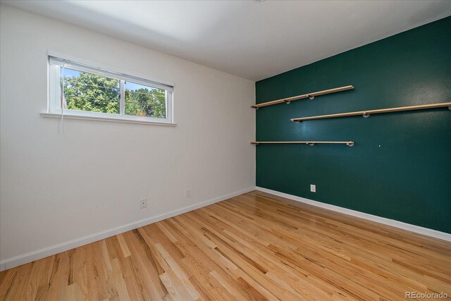 5975 Dover St, Arvada, CO 80004 - unfurnished room featuring wood finished floors and baseboards