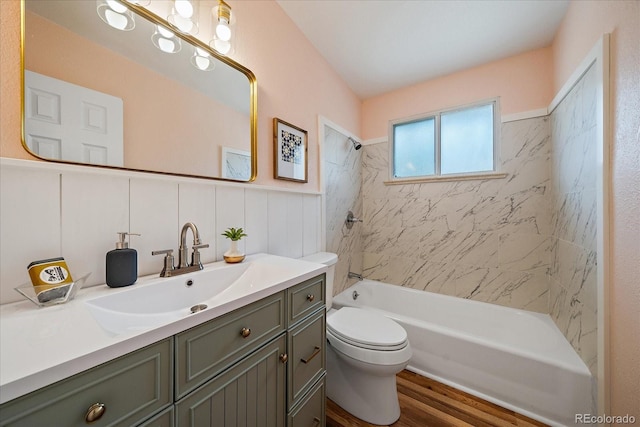 5975 Dover St, Arvada, CO 80004 - full bathroom featuring vanity, wood finished floors, and washtub / shower combination