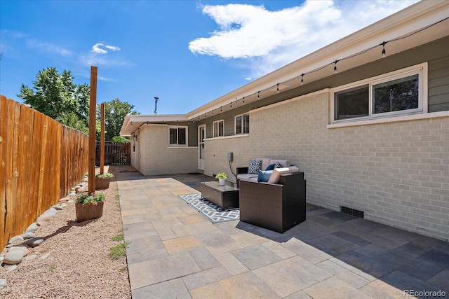 5975 Dover St, Arvada, CO 80004 - fenced backyard featuring a patio and an outdoor living space