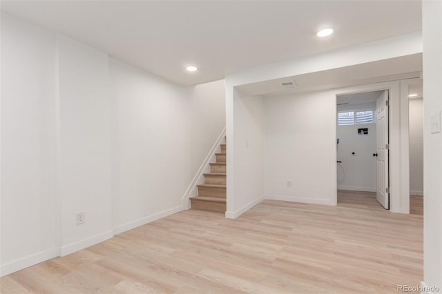 basement featuring light hardwood / wood-style flooring