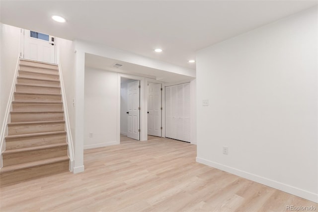 basement featuring light hardwood / wood-style floors