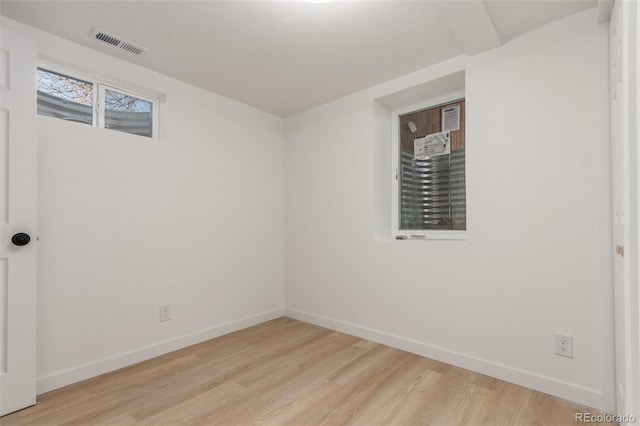 spare room with light hardwood / wood-style floors