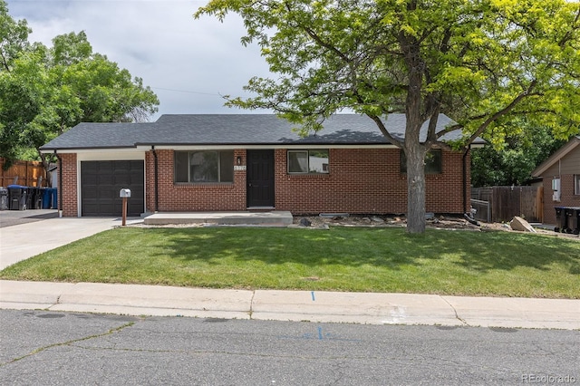 6176 Ammons St, Arvada, CO 80004 - ranch-style home with an attached garage, driveway, brick siding, and roof with shingles