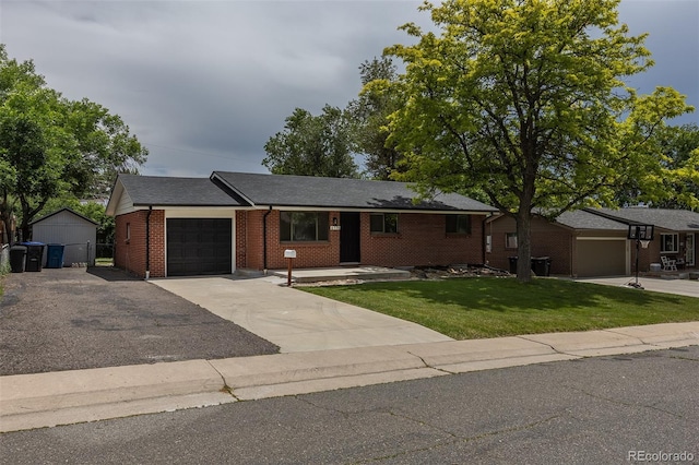 6176 Ammons St, Arvada, CO 80004 - single story home featuring an attached garage, driveway, a front yard, and brick siding