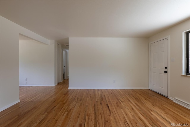 6176 Ammons St, Arvada, CO 80004 - spare room featuring light wood-type flooring and baseboards