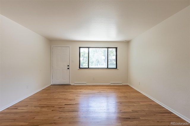6176 Ammons St, Arvada, CO 80004 - empty room with wood finished floors and baseboards