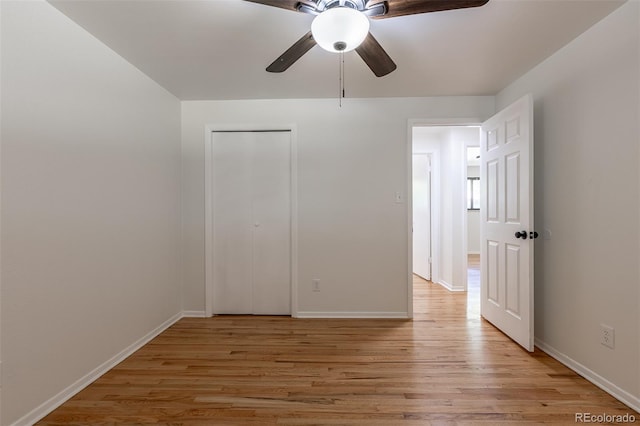 6176 Ammons St, Arvada, CO 80004 - unfurnished bedroom featuring light wood finished floors, a ceiling fan, and a closet
