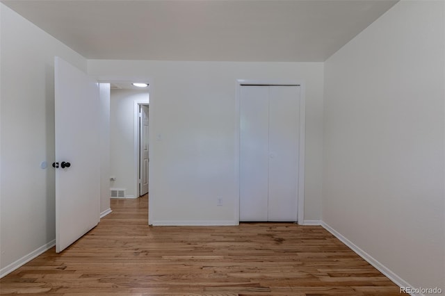 6176 Ammons St, Arvada, CO 80004 - unfurnished bedroom featuring light wood-style flooring and a closet