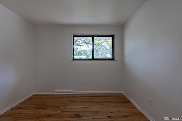 6176 Ammons St, Arvada, CO 80004 - spare room featuring wood finished floors and baseboards