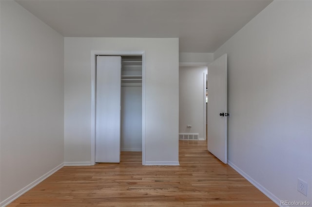 6176 Ammons St, Arvada, CO 80004 - unfurnished bedroom with light wood-style flooring and a closet