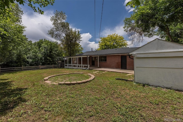 6176 Ammons St, Arvada, CO 80004 - fenced yard with a sunroom and a patio area